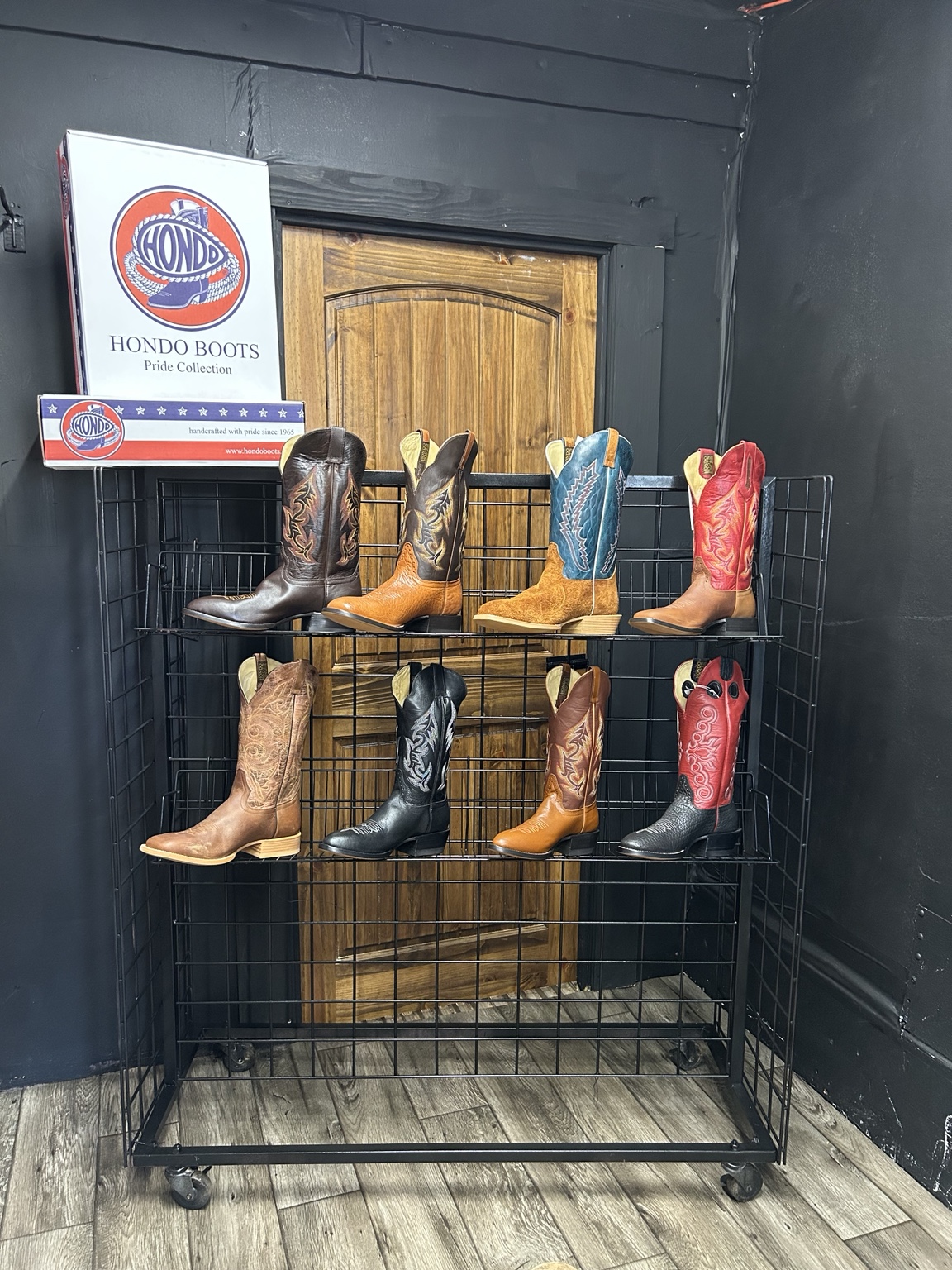 Hondo Boots displayed on a rack at Thin River Ranch