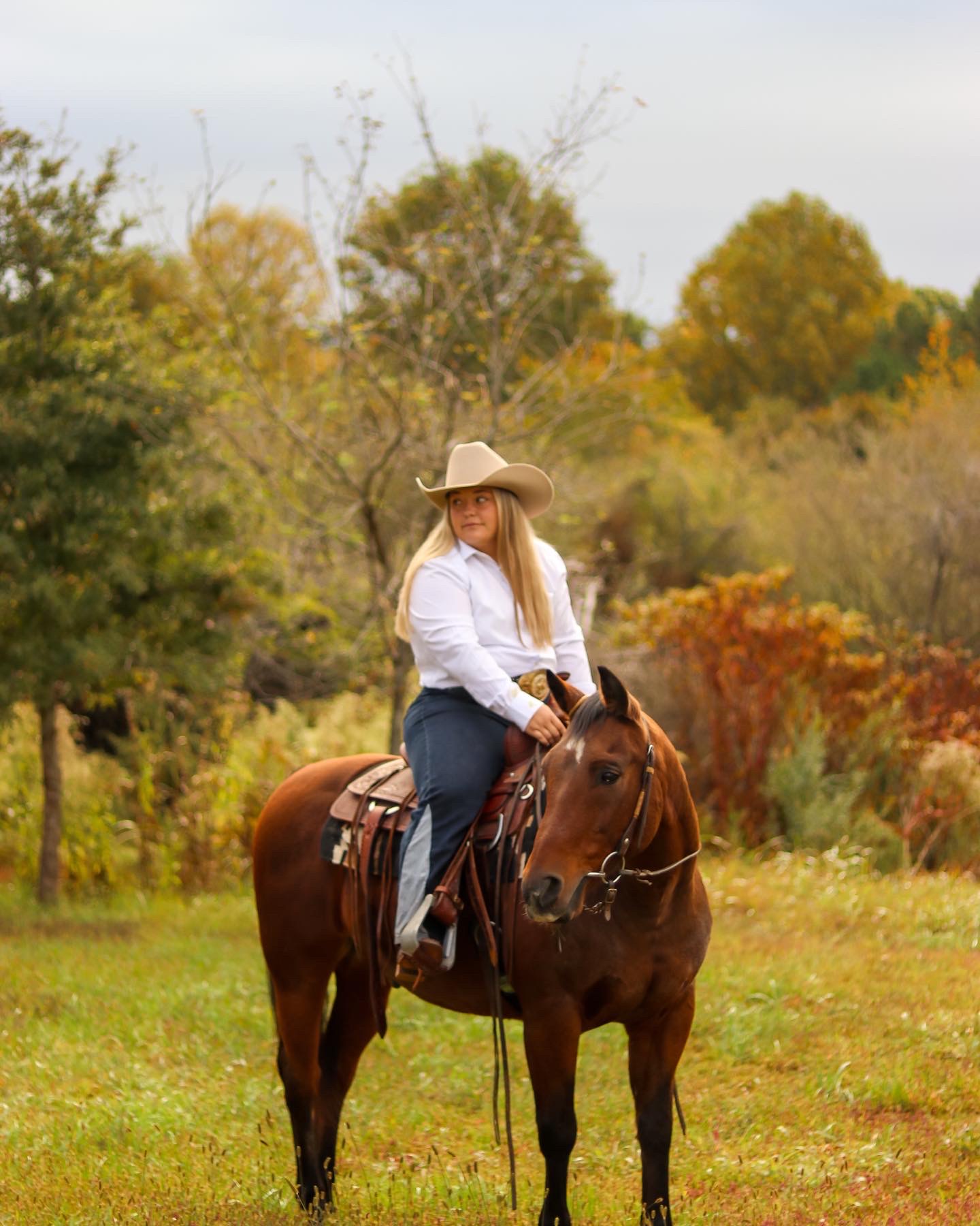 Woman riding a horse in a western setting